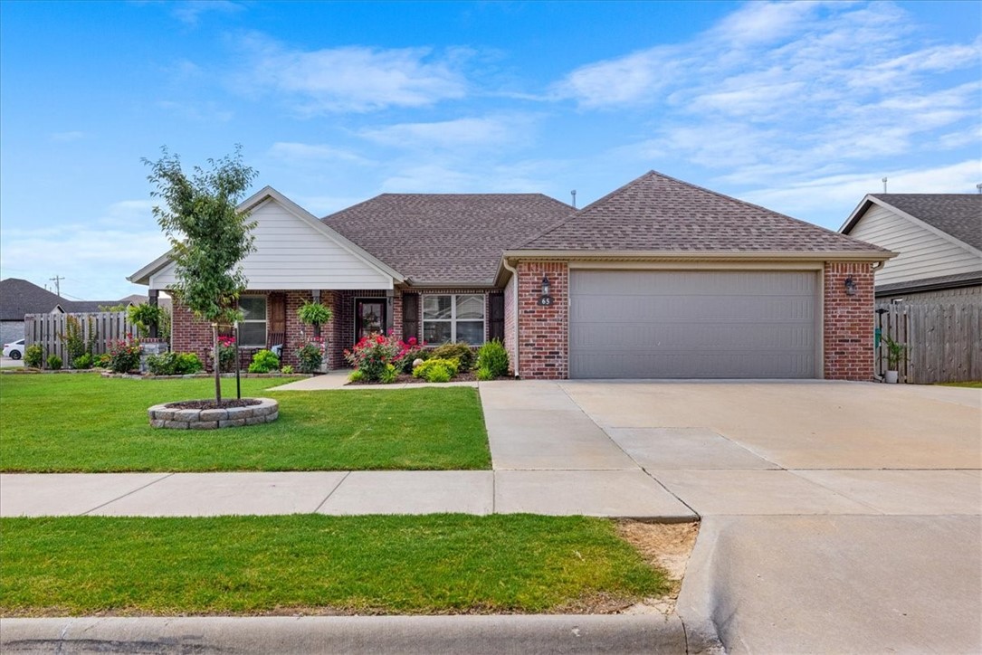 This immaculate 4-bedroom, 2-bath home on a corner lot truly checks all the boxes! The beautifully landscaped yard features a covered patio perfect for relaxing, along with a concrete pad and gated street access to the backyardāideal for parking an RV or boat. Additional exterior perks include extra electrical outlets, including two 220 amp outlets ready for camper hookup, hot tub, pool equipment and a great garage workspace that conveys with the home. Extra concrete slab in backyard for additional patio, RV or boat. Inside the home offers quartz countertops, ample cabinet and counter space, three potential pantry closets, upgraded lighting throughout, a desirable split floor plan, generously sized bedrooms, and walk-in closets. Home was upgraded with wood flooring throughout the living area and all bedrooms. The location is unbeatableājust a short walk to Jerry Pop Williams Elementary, with easy access to the community pool, resort-style covered pavilion, park, and only minutes from the University of Arkansas.