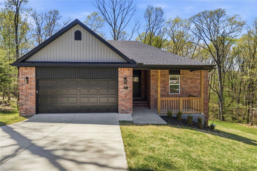 Nestled on a quiet circle, this stunning home sits on a rare double lot, offering an expansive, private retreat that is hard to find. The interior features an open floorplan anchored by a gourmet kitchen with sleek granite countertops, making it a perfect space for both daily living and effortless entertaining. Large windows throughout invite natural light and provide peaceful views of the surrounding wooded landscape, blending modern comfort with the natural beauty of the Ozarks.

Location is everything , as this property offers immediate access to the Little Sugar Trail System and the legendary Tunnel Vision Loop. Beyond the world-class mountain biking, you are just minutes away from the serene waters of Lake Avalon and Lake Windsor, as well as the premier amenities of the Branchwood Recreation Center. This is a unique opportunity to enjoy a quiet neighborhood setting while staying perfectly positioned to enjoy the very best of Bella Vista’s trails, lakes, & golf courses.