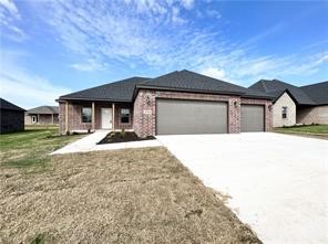 Conveniently located close to the Pea Ridge High School, trails, and only 15 minutes to downtown Bentonville. The "Williams" plan features a wood privacy fence, 4BDs, 2.5BA's, modern quartz counters, custom cabinets w/ wood hood above gas range, large island, covered patio, and a 3 car garage! Full sod + landscaping package. *Pictures may not be of exact Unit available*