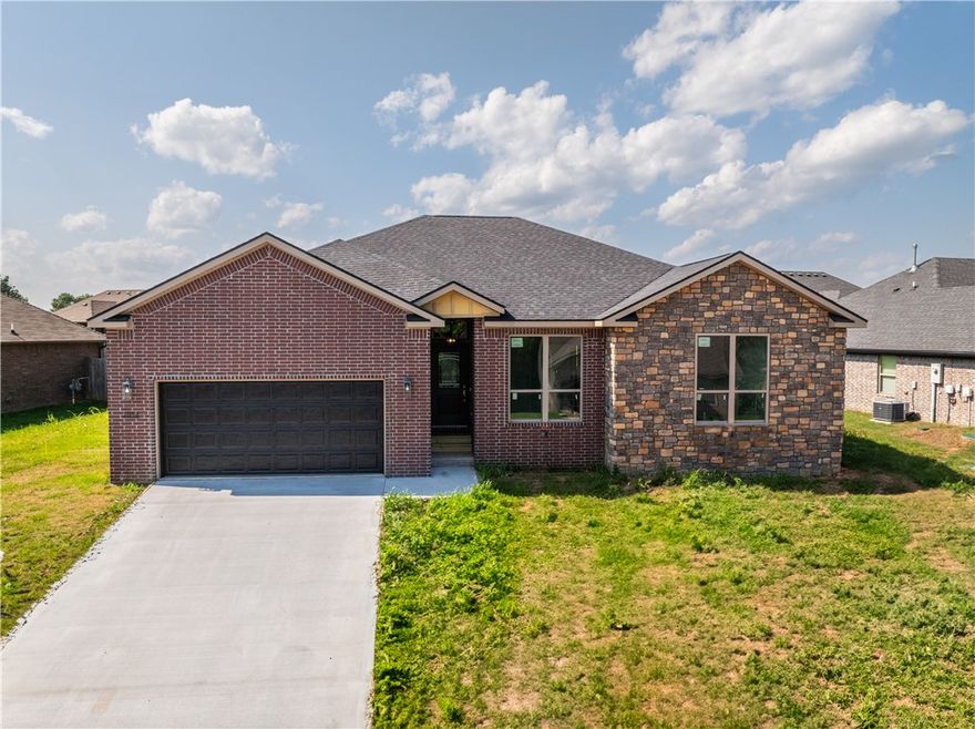Bentonville Schools! Easy access to XNA Airport, JB Hunt, Walmart HO, and Tyson.  New construction home with COO in the heart of Northwest Arkansas. This amazing brick home has a split floor plan with 4 bedrooms, 2 full baths and large walk-in closets. Oversized windows allow great ambiance and natural lighting throughout. Many custom additions to this home including granite counters, ceiling fans, utility sink in laundry, soft close hinges, lighted mirrors, security lights and great storage.  Short commute to all of NWA and the 112 corridor will only make that easier. $5000 seller credit for upgrades or closing costs with preferred lenders.