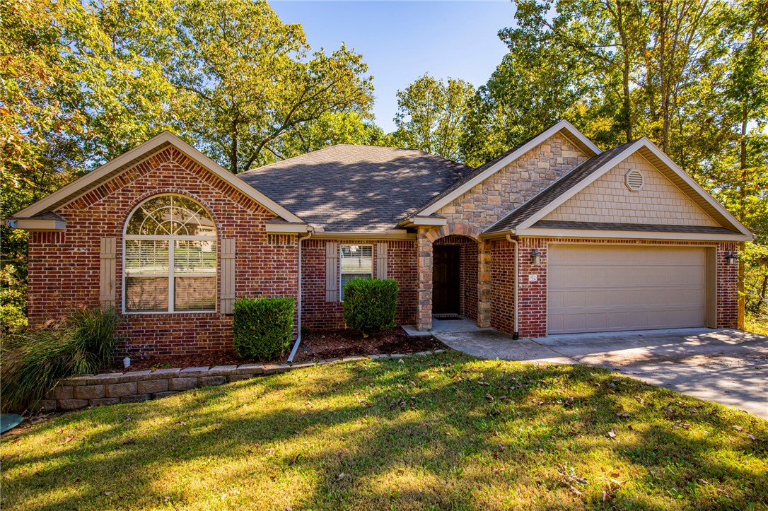 Come see this cute home tucked into the woods at the end of a quiet cul-de-sac. Hop onto the greenway or the Back 40 with no need to load those bikes onto a vehicle. Blowing Springs trails are so accessible, you can connect to Bentonville trails with ease. The Metfield golf course and Skills Park are moments away. This home has space for a firepit in the backyard and the wooded privacy is wonderful. New LVP flooring and paint throughout.