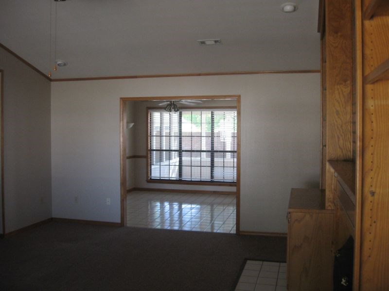 three bedroom and two full baths. all brick home. Ceramic tile in kitchen, dining rom, breakfast nook and bathrooms. Ceiling fans throughout and fenced back yard. living room has vaulted ceiling, fireplace and built in bookcases. Easy access to shopping and I49.