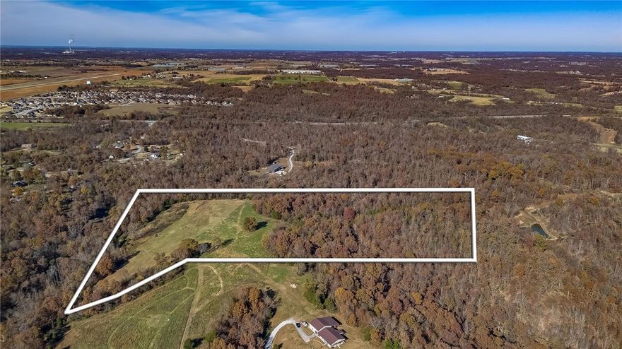 Discover 21 beautiful acres just outside the city limits of Siloam Springs, offering the perfect balance of privacy and convenience. Located just over a mile from Highway 412 with all paved road access to the property entrance, this land features a deeded easement from the main road. Utilities including gas, and electric are available at the road, onsite well and septic needed. Enjoy breathtaking sunsets, abundant wildlife, and a desirable mix of wooded areas and open pasture. Ideal for building your dream home or for future development as Siloam Springs continues to grow. Minutes from the Siloam Springs Kayak Park and the Illinois River, perfect for floating and smallmouth fishing. Only 10 minutes to historic downtown Siloam Springs, 25 minutes to I-49 and Springdale, and approximately 13 minutes to the new 612 Bypass upon completion. Country living with shopping and restaurants just minutes away!