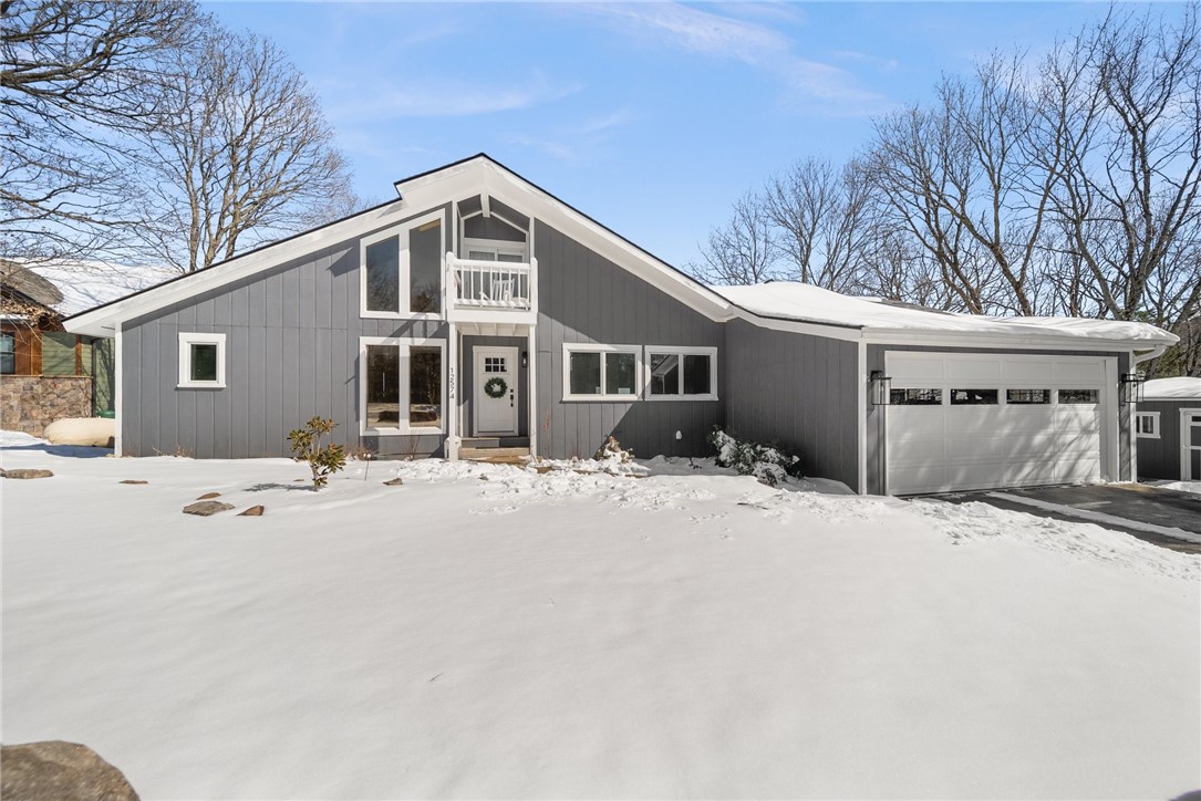 Completely remodeled 1,906 sq ft home boasting panoramic views of Beaver Lake, presents a modern oasis with open floor plan, featuring expansive windows that seamlessly blend the indoor living space with the the stunning lake scenery. Perfect for relaxing & taking in the natural beauty from every room. Interior renovation in 2022 & 2024 includes new HVAC, 2 tankless wtr heaters, new kitchen cabinetry, quartzite countertops, propane cooktop, under counter beverage refrigerator, and large island.The living room with a cozy wood stove, Pella slider and windows, 3/4" white oak wood flooring throughout the main level, opens to a lake view large deck equipped with a new Jacuzzi hot tub, providing the ultimate water view experience. New high-impact shingles in 2024, Encapsulated crawl space with dehumidifiers in 2024. Stitt Energy added solar panels in 2019. Loft is currently being utilized as 3rd BR. This totally remodeled home offers a luxurious retreat with stunning views perfect for those seeking a tranquil lifestyle.