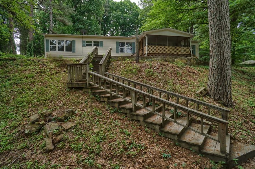 Beautiful 3 bedroom, 3 full bathroom manufactured home offering 1,792 square feet situated on 4 surveyed acres with a
permanent foundation! This property features a spacious open layout with a cozy fireplace, creating the perfect space for
both relaxing and entertaining. The kitchen comes equipped with new appliances, and the home offers a functional layout
with plenty of room for everyday living.
Outside, you’ll love the gorgeous and peaceful setting made for entertaining friends and family! The property also includes
a small storage building and a carport for additional convenience. It has that feeling of being way out in the country while
still being just a short drive from town. If you’ve been looking for acreage with a beautiful home, new appliances, privacy, and a move-in
ready feel, this one is definitely worth seeing!