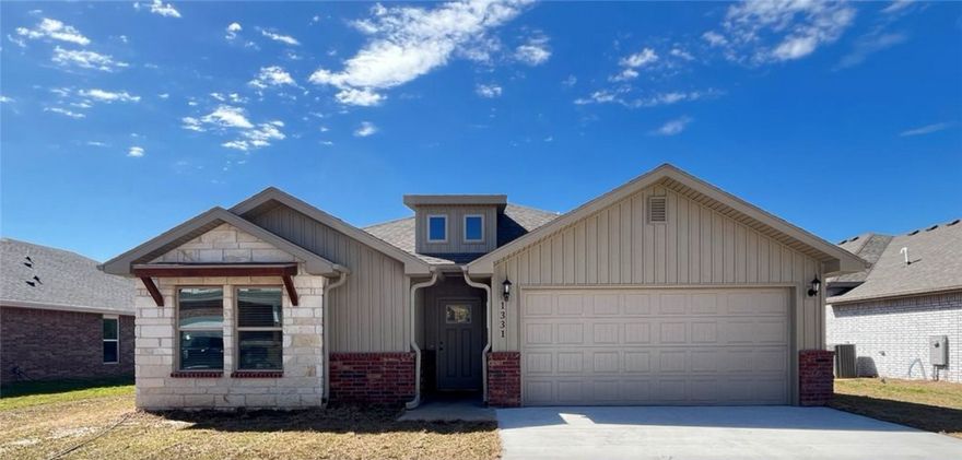 This nearly-new, single-story home in the Timber Ridge neighborhood in Centerton offers 4 bedrooms, 2 bathrooms, and 1,962 sq ft of comfortable living space. Built in 2024, the home features a spacious open-concept design with a large living area, a modern kitchen with granite countertops, and black stainless steel appliances, including a refrigerator, gas range, microwave, and dishwasher. The master suite boasts a walk-in closet and a private bathroom with a soaking tub and separate shower. Additional highlights include hardwood-look tile flooring in the main areas, carpeted bedrooms, and blinds on all windows. The property also offers a two-car garage and a fully fenced backyard for added privacy.