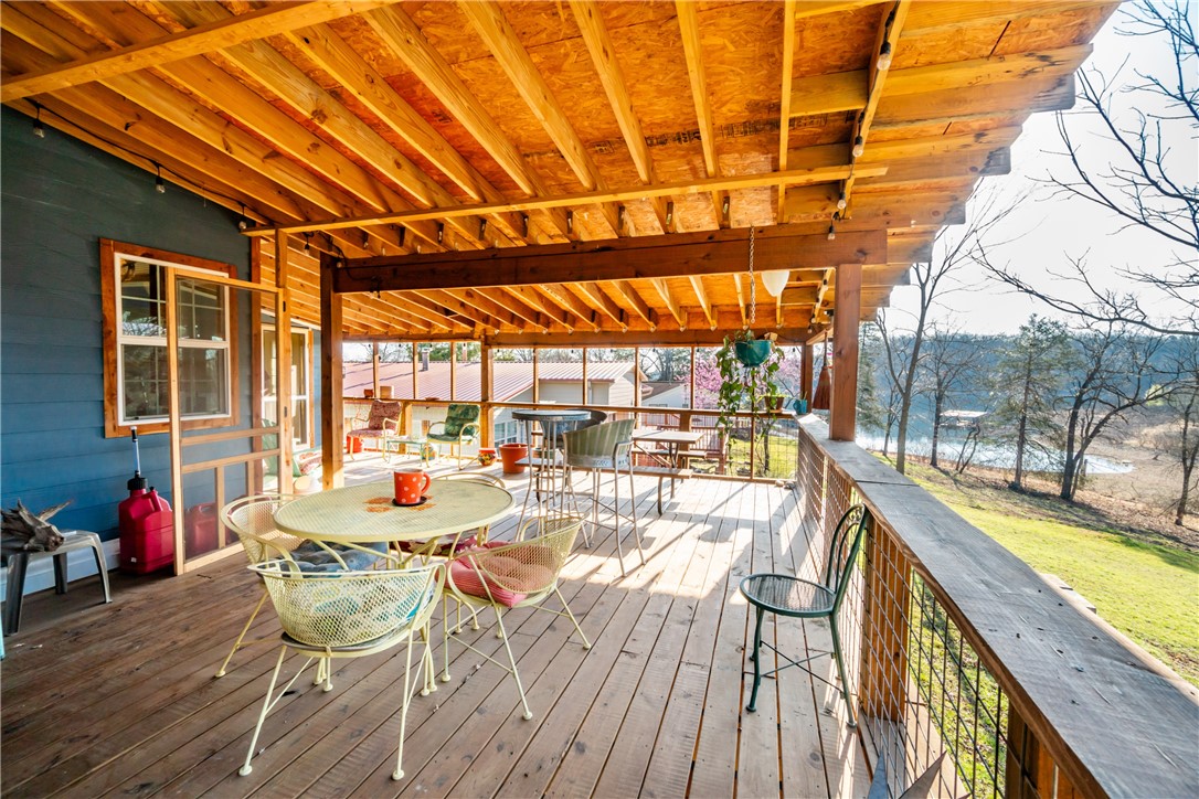 Live the lake life! Here is your chance to literally wake up to a gorgeous view of the lake, strolling right out to your massive wrap-around deck as you sip your coffee over-looking the deep serenity and quiet. This adorable 2br/2ba lake cabin sits on a large .29are lot, and has been renovated from the studs up: concrete siding, updated plumbing, electrical, roof, windows, deck, hvac, water heater, insulation, etc and more! House also includes a wonderful workshop down below! and offers a number of other fantastic amenities: massive eat-in kitchen, spacious dining area, cedar wrapped posts, and a wonderfully efficient pellet-burning stove to name but a few. Don't miss your chance to live on the lake!