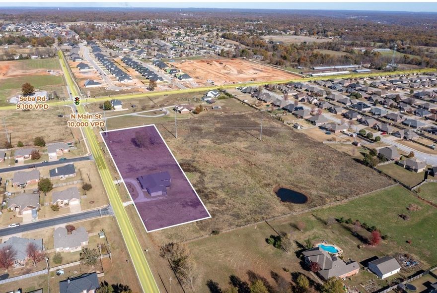 Land with approximately 620' of frontage on N Main St.  The land has a 3801 SF building.  Great development opportunity.