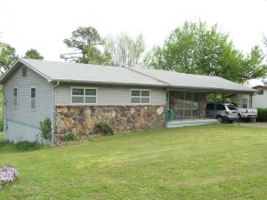 Nice 3BR 11/2 bath rock and vinyl home with CH/A on quiet street. Home has been well kept. Has large kitchen and dining area, full unfinished basement, workshop in basement. Has backup gas heat. Covered deck, double carport. Large back yard with nice spot for garden. Sq. footage per assessor.