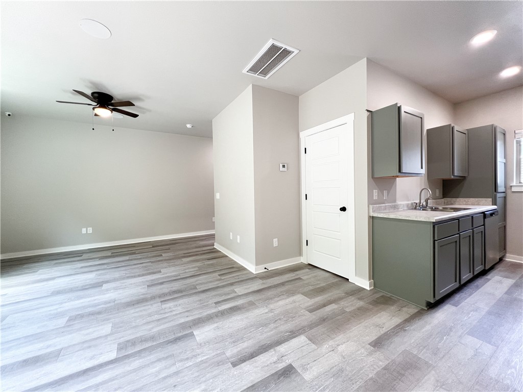 Like-New Townhome Near U of A – Ideal for Investors or Razorback Fans! This well-maintained 2-bedroom, 2.5-bath townhome offers low-maintenance living in a prime Northwest Arkansas location—just minutes from the University of Arkansas, shopping, dining, and I-49. Whether you're looking for student housing, a game-day getaway, or a smart addition to your rental portfolio—this townhome checks all the boxes! Both upstairs bedrooms include private en suite baths, perfect for roommates or guests. Durable LVP flooring runs through the main living areas, with carpet in the bedrooms and on the stairs. The kitchen features stainless steel appliances, including a refrigerator with water and ice in the door. A full-size washer and dryer are also included. Relax or entertain on the covered back porch and enjoy extras like ceiling fans in every room and two assigned parking spaces.
