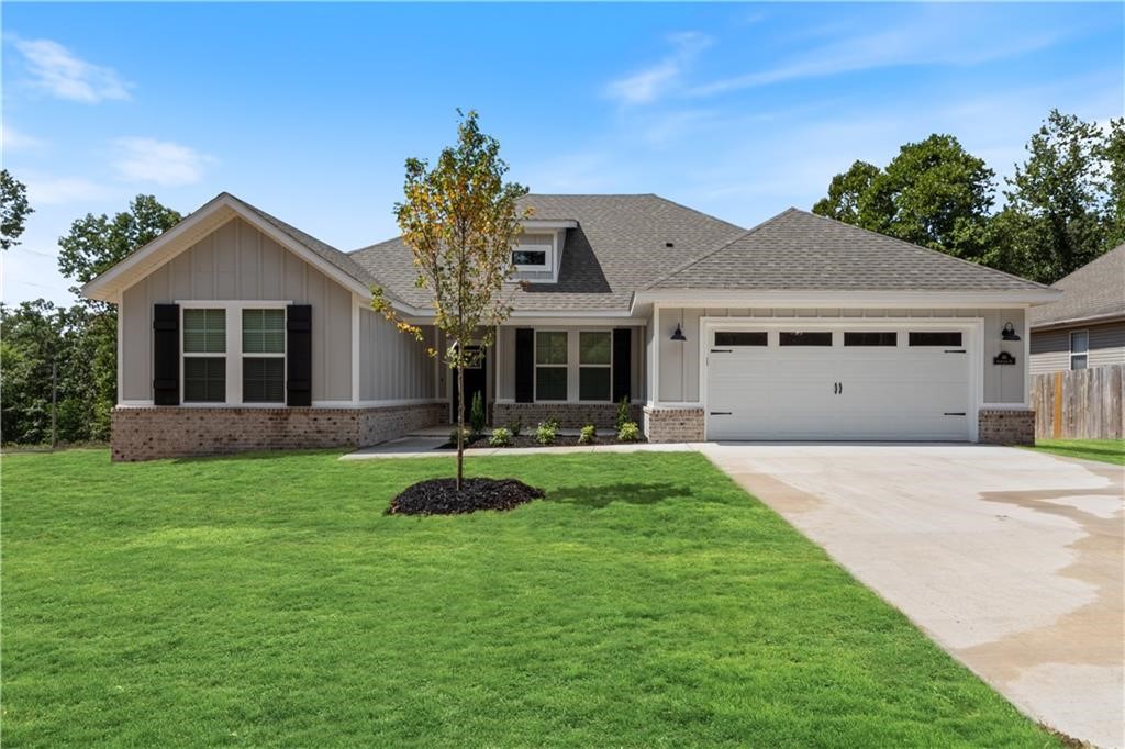 Photos are not of exact home/finishes. This stunning new construction home offers a perfect blend of luxury & comfort while sitting on almost a half an acre DOUBLE LOT! The spacious 4-bedroom, 2-bathroom features a split floor plan that enhances privacy, while the vaulted ceilings with custom wood beams add a touch of elegance. Inside, you'll be greeted by luxury vinyl plank floors & a cozy gas fireplace. The kitchen boasts a gas range, quartz countertops, & modern finishes. Relax in the spa-like primary bathroom, complete with an oversized walk-in shower & soaking tub. Enjoy ample storage with walk-in closets & step outside to a private covered back patio, perfect for entertaining or unwinding. This home is just minutes from Lake Ann & Lake Norwood. Experience the ideal combination of style, space, and convenience at this exceptional property. Ask about additional preferred lender credit!