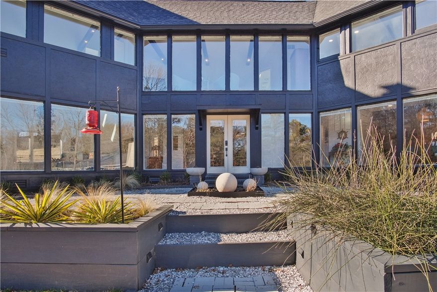 Professionally renovated Scandinavian-style home on Mt Sequoyah with beautiful views. High-tech upgrades throughout, new roof & gutters, new driveway, Tesla charging station, new white oak floors, new duct work, new electrical, new plumbing, 2 HVAC systems, new tankless water heater, high-end appliances, imported Spanish tile backsplash and new fixtures & hardware. Too many upgrades to list! Live in the heart of Fayetteville and the middle of nature.