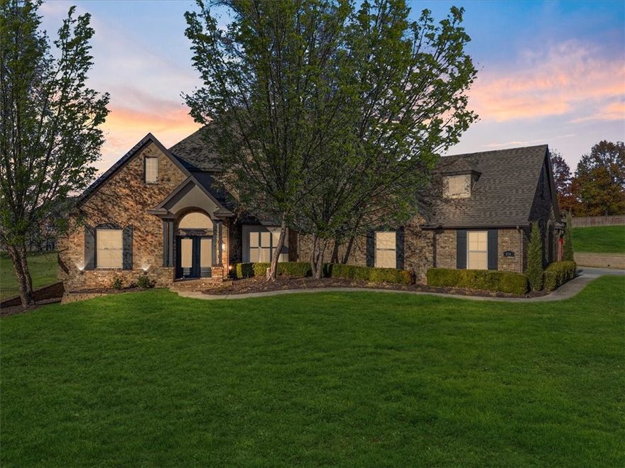 Welcome to 834 Sheffield Street, an estate style home where timeless charm meets modern comfort, nestled on over an acre. This residence offers over 5,100 sq ft of thoughtfully designed space, ideal for growing families or avid entertainers. From the moment you step into the entryway, you’ll be captivated by natural light, soaring ceilings, and refined finishes. The kitchen is a dream, featuring double islands, quartz countertops, and ample cabinetry, perfect for hosting. The primary suite offers flex space for a desk/seating area. The ensuite bath includes a walk-in shower, whirlpool tub, dual vanities, and a generous walk-in closet. With 5 bed, 5 bath, office, formal dining and living room, an upstairs craft room, and a walkout basement, this home has room for everything. Step outside to a resort-style saltwater pool & outdoor kitchen. Updates include new paint, flooring, fixtures, newer roof, and more. All minutes from Arvest Ballpark, Tontitown Winery, Arkansas Children’s Hospital, and under 10 minutes to I-49!