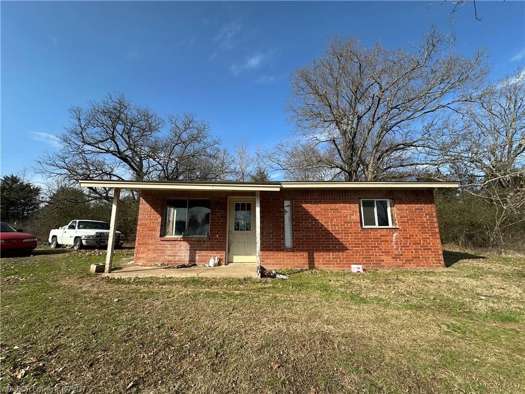 Home being sold AS IS. 2 bedroom/1 bath. 2 living areas. No appliances. Laminate wood & tile floors, no carpet. Home is plumbed for HVAC but HVAC is not in working order. Located on .9 of an acre. Home will not go government loan.