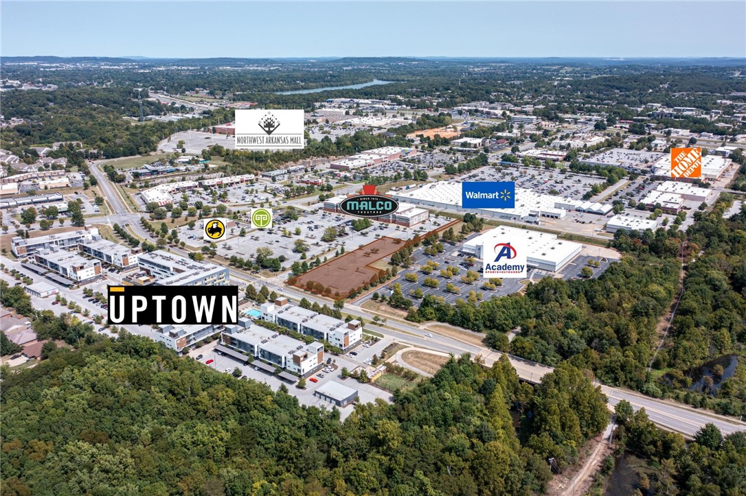 1.67 acre commercially zoned lot situated between Academy Sports, Malco Theatre, and Taziki's. In the heart of Uptown with over 1,000 Class A multifamily units in walking distance. All utilities available on-site. One of the last remaining opportunities in an established retail district on a signalized hard corner. Reciprocal parking agreement. Paved, striped, and lit. Mud Creek Trail access.