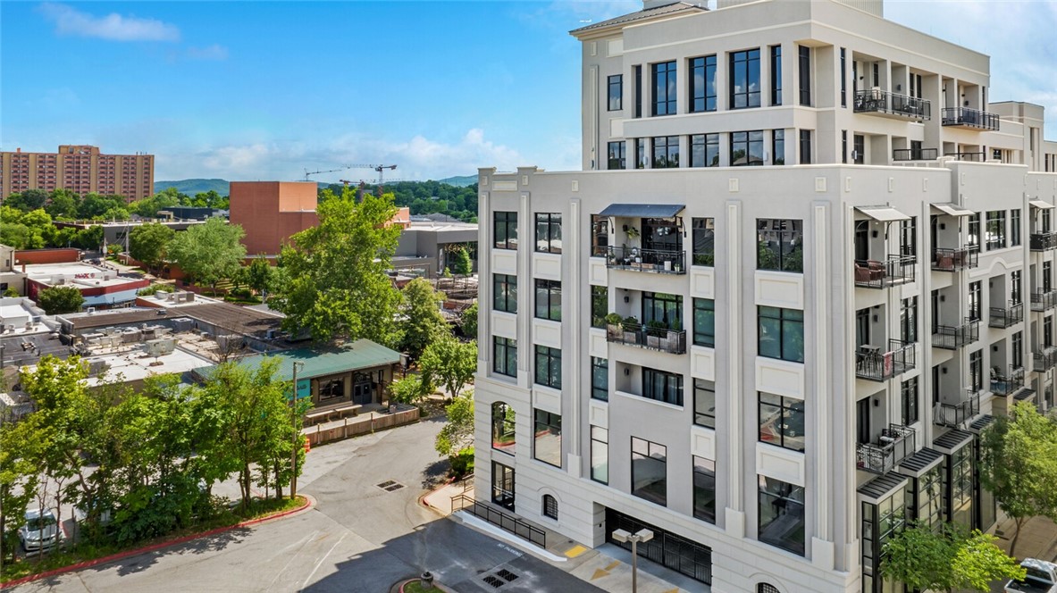 Experience vibrant downtown living in this beautiful 1-bedroom, 1.5-bathroom condo located in the prestigious Legacy Building in Fayetteville. Nestled on the 5th floor, this move-in-ready home offers the perfect combination of modern elegance and urban convenience.
Step inside to discover a kitchen outfitted with granite countertops and appliances that convey, making your move seamless. Enjoy an abundance of natural light and the luxury of a spacious walk-in closet.
Located just steps from Dickson Street, the University of Arkansas, and the downtown square, you’ll have easy access to Fayetteville’s best nightlife, music, arts, sports, trails, and dining. Whether you’re seeking an active lifestyle or a serene retreat, this condo delivers it all.
Don’t miss your chance to own a slice of Fayetteville’s vibrant downtown scene!