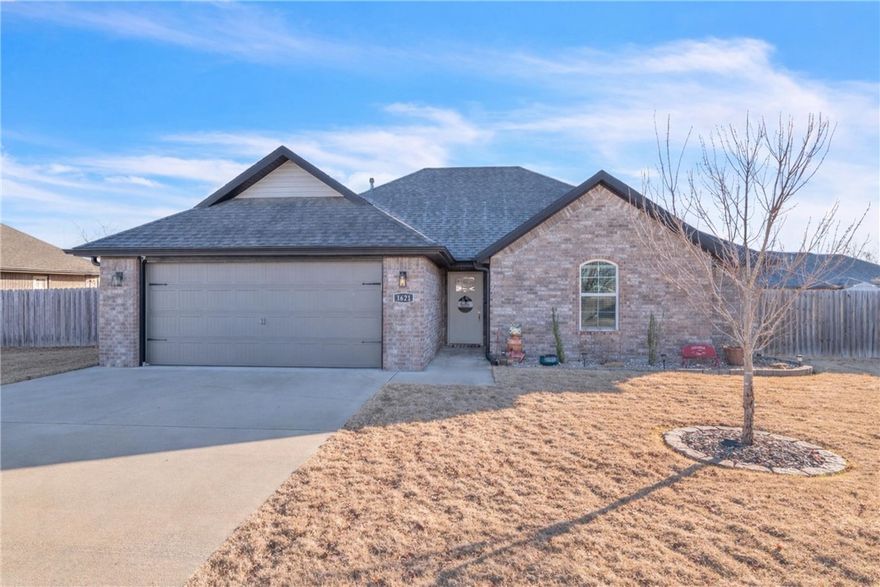 Welcome home to 1621 Whirlaway Lane in charming Prairie Grove! This well-maintained 3-bedroom, 2-bath ranch-style home offers a perfect blend of comfort, style, and functionality, all conveniently located near local parks and schools. Enjoy durable, easy-care wood-look tile flooring throughout the main living areas, a beautifully updated tile shower in the primary suite, and sleek stainless steel appliances in the kitchen. Relax by the cozy gas fireplace on cooler evenings or step outside to the spacious covered patio and additional wood deck—ideal for entertaining or unwinding outdoors. Completing the home is a 2-car attached garage and a wood privacy fence, providing both convenience and privacy.