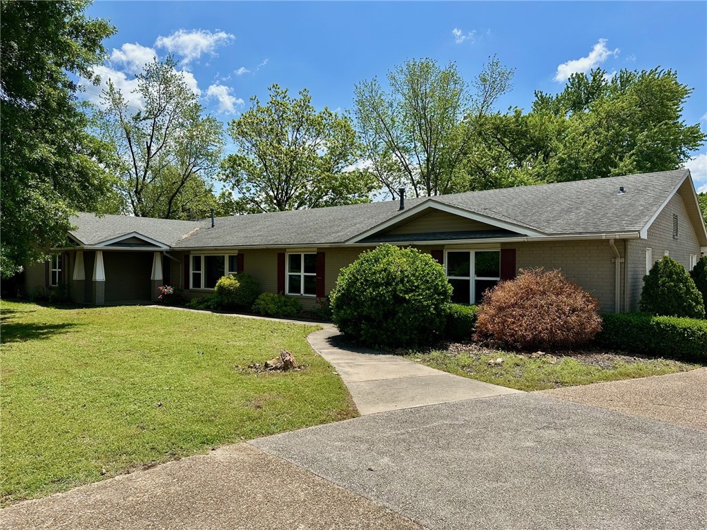 Plenty of space inside and out with 4 bedrooms and 5 baths perfect for a large family/mother-in-law. Each bedroom has a full bath, some have walk-in closets, plus plenty of storage space throughout. Use the extra 1/3 acre lot for a shop, big garden, or small home. Some updates include granite countertops and engineered wood flooring. Outside lots of space for outdoor living and garden spots between several trees providing ample shade. Just a few minutes away from Springdale and Rogers.
