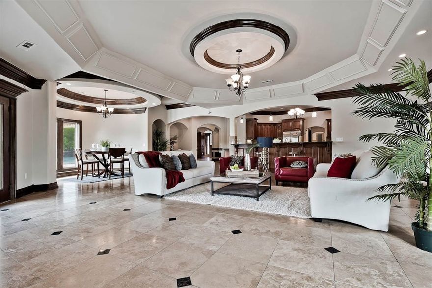 Luxury Mediterranean Resort Estate in gated community. Elegance's throughout. Stunning details awaits around every corner. 2 master suites on main level. 2 family rooms, large office, formal dining, breakfast nook. Grand entry, soaring ceilings, marble columns, several balconies. 2.70 acres w/ Private outdoor oasis w/outdoor kitchen,4 car garage W/additional detached 2-story garage/workshop. Gunite pool,1/2 basketball court, fire pit.Patios across entire back of home. 5 doors lead to outdoor living area.