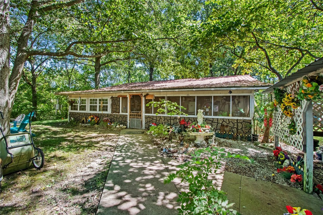 Nearly 20 acres close to Garfield with a single story ranch house nestled in beautiful mature trees with no restrictions on your dreams! Extra RV plugs for family to come and visit, and two possible entrances to the property from either Roberts Loop Spur or Hwy 127. A spring down in the holler , one big plum tree, multiple hickory, walnut, and three big planted pecan trees on this land make it the ideal place to raise your children a few miles to Beaver Lake. What could you do with 20 acres in the country; how many memories could you make?
Do you like to deer hunt? How about gardening or running some cows? The possibilities are endless!