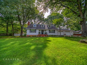 The curb appeal and beautifully upgraded home makes this home ready for it's new owners. Large living and dining room welcomes you into this traditional styled home. The updated large kitchen has granite countertops, upgraded appliances, two pantries, and built-in work desk! The main level master suite includes a walk-in shower, freestanding garden tub, double vanity, and walk-in closet. The fenced backyard has a dual level covered patio, beautiful landscaping, and a She/He shed. The oversized two car garage has a bonus room that makes a great workshop area. Additional updates include, wood floors, crown molding, lighting, expanded laundry, mud room.