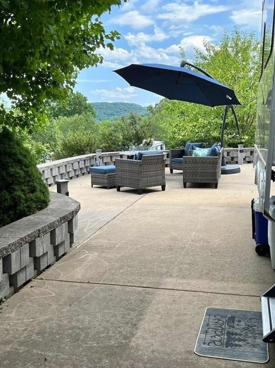 Enjoy the fabulous views of Table Rock Lake and the Ozark mountains! This gorgeously landscaped lot is perfect for entertaining family and friends. The spacious lot includes an Outdoor kitchen, dining table, sturdy patio furniture, gas fire pit, and Club Car golf cart with new batteries. Need more? The luxury RV resort is just 30 short minutes to Branson Missouri and amenities include:2 pools, tennis, pickle ball, basketball courts, boat storage, boat launch, courtesy dock, clubhouse and community center. Make it a package deal by adding additional recreational items like the 2016 Blueridge 3025rl by Forest River 5th wheel with newer Ashley Italian leather furniture, modern decor, and a top of the line Wilderness RV king mattress for $27,000. ** Combo Package available for both lot and RV $95,000