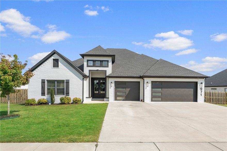 Motivated sellers relocating and looking for a quick close! Experience elevated Bentonville living at 971 Osage View Dr.—a stunning luxury retreat perfectly positioned near the Walmart Home Office, top-rated schools, and scenic trails. Step inside to discover refined design, soaring ceilings, and sun-filled spaces ideal for both relaxing and entertaining. The open-concept kitchen features designer finishes, premium cabinetry, and sleek surfaces that flow seamlessly into the spacious living area and cozy fireplace. The primary suite offers a spa-inspired bath and walk-in closet, while guest rooms provide comfort and style. Outside, enjoy a covered patio overlooking a landscaped yard perfect for quiet mornings or weekend gatherings. With a recent price reduction, this home delivers exceptional value in one of Bentonville’s most desirable neighborhoods. Luxury, location, and lifestyle—yours to claim. Ask about our preferred lender credit!