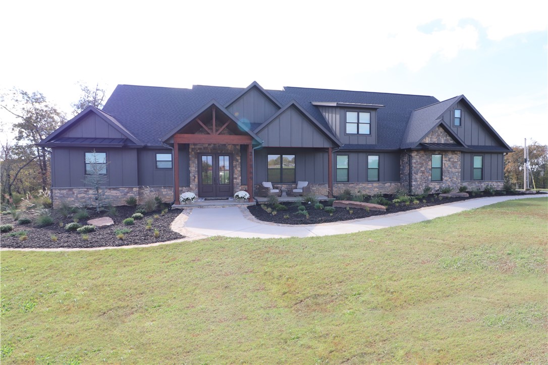 Craftsmanship & comfort converge in this 3,790 SF custom-built masterpiece on 3.2 acres in W Sdale/Tontitown. Designed with every imaginable upgrade and an open layout perfect for entertaining or everyday living. The kitchen features a commercial gas range w/double oven, pot filler, & appliance garage. The primary offers a spa-inspired bathātiled pebble shower w/dual heads & rain head + an infrared sauna large enough to recline. Safe room w/poured concrete walls & Fort Knox vault door. Home office offers custom builtins, elegant millwork & French doors. The utility suite adds practical luxury w/custom cabinetry, drop zone, dog wash & kennel. Oversized 4-car features 3 27-ft-deep bays for 1-ton trucks or boats. Walk-out attic provides storage or future living space. The modern exterior pairs dark siding, timber accents & stone details against scenic countryside. Additional acreage available. Minutes from the new 612 Bypass, this home delivers rare tranquility, convenience & unmatched custom quality.Agent Owned