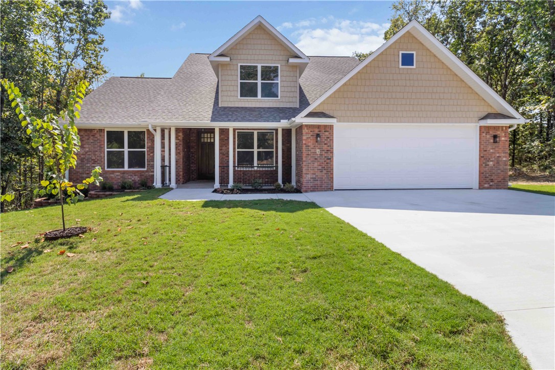 Brand-new, top-quality Bella Vista home built by an exceptional builder! The spacious great room with 11-foot ceilings flows seamlessly into the large dining area. The expansive kitchen features quartz countertops, a walk-in pantry, and a formal dining space. The main bedroom suite offers a generous walk-in closet and a luxurious oversized custom tile shower. Upstairs, you’ll find two additional bedrooms, a full bath with a double vanity, a large linen closet and an all purpose bonus room filled with natural light from energy-efficient windows. Enjoy the privacy of a quiet street and the magnificent wooded POA property view from the covered deck. This home also includes an oversized two-car garage.
