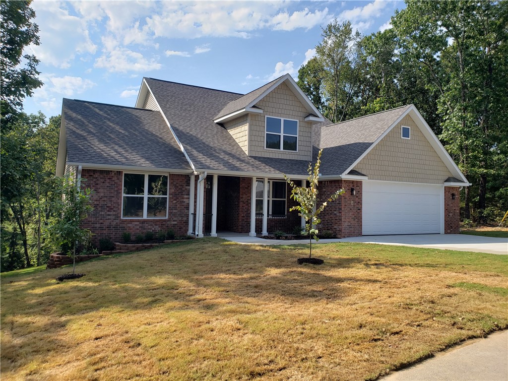 Brand-new, top-quality Bella Vista home built by an exceptional builder! The spacious great room with 11-foot ceilings flows seamlessly into the large dining area. The expansive kitchen features quartz countertops, a walk-in pantry, and a formal dining space. The main bedroom suite offers a generous walk-in closet and a luxurious oversized custom tile shower. Upstairs, youāll find two additional bedrooms, a full bath with a double vanity, a large linen closet and an all purpose bonus room filled with natural light from energy-efficient windows. Enjoy the privacy of a quiet street and the magnificent wooded POA property view from the covered deck. This home also includes an oversized two-car garage.