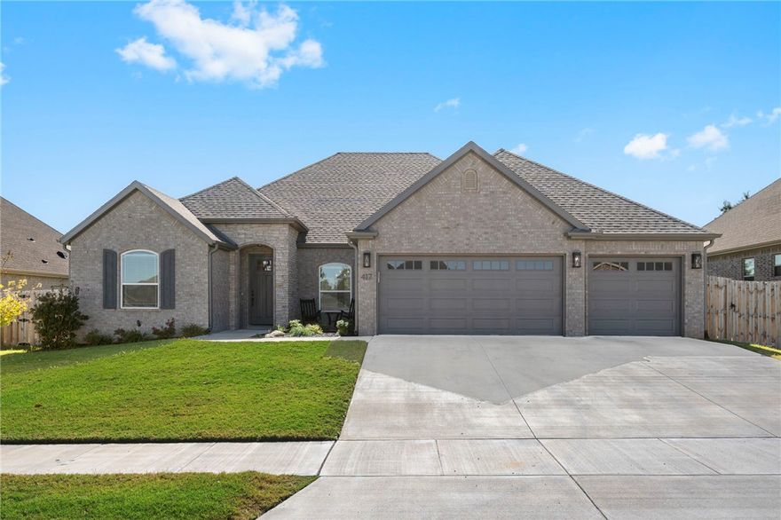 This stunning 4-bedroom, 3-bathroom home features an in-ground heated saltwater pool and landscaped yard. Perfectly located near schools, shopping, and dining, offering an open floor plan with wood floors, vaulted ceilings with beams, and natural light. Living area features a fireplace and built-in bookcases, while the chef's kitchen includes a large island with seating, pendant lighting, stainless steel gas cooktop, wall oven, and custom cabinets with under-lighting. Breakfast nook and formal dining room. Primary suite features a spa-like bath with tile shower and seat, plus walk-in closet with custom built-ins connecting to utility room. Additional bedrooms include one with double-door entrance and vaulted ceiling, another with private en suite bath. Covered patio overlooks resort-style pool, ideal for entertaining. Features include 3-car garage with custom shelving, alarm system with keyless entry and cameras, front courtyard patio, crown molding, and tray ceilings throughout.