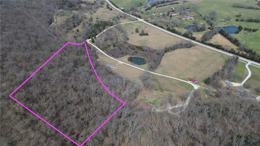 9.7 acres of stunning wooded Ozark land with beautiful bluff features, abundant wildlife, and the peaceful privacy so many buyers are searching for. This scenic parcel offers a perfect setting for hunting, recreational use, camping, or building a secluded cabin or getaway surrounded by nature. Mature timber, natural rock formations, and rolling terrain create a true outdoor retreat with endless opportunities to explore and enjoy the land. Located just 15 minutes from Eureka Springs and near the Missouri state line, you’ll have easy access to excellent hunting, fishing, hiking, floating, and countless outdoor adventures throughout the Ozarks. The adjacen parcels and mobile home may also be available for purchase, offering the potential to expand your acreage and create a larger private retreat or investment opportunity. See MLS 1340579