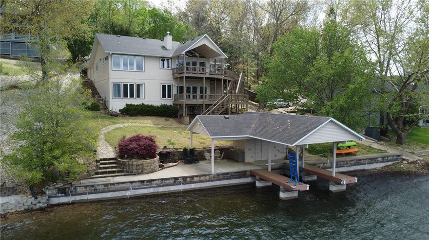 Lake Windsor lakefront living at its finest! Amazing views throughout! Windows everywhere! Beautiful open floor plan with 2 beds and office/study on main floor. A second large living room along with 3rd bedroom and full bath in walkout lower level. Huge, covered deck of main living area and another covered deck off walk out lower level! Very short walk to covered boat dock with lift, wet bar, patio, swim deck and lots of storage including a refrigerator! This incredible property is priced to sell so come see it soon and have your best summer on Lake Windsor!