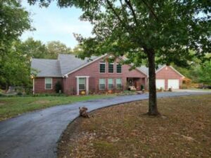 Beautiful Custom Home on 2.31 Acres right on the doorsteps of Mount Nebo ! This 4 Bedroom 3 Bath home with a shop is everything you have dreamed about and more! Owner has updated to granite countertops, new heat and air, new septic system and new updated vanities. As you enter the home you will see the breath taking stair case with built in shelves and the beautiful open living room complete with a wood burning fire place for those cool fall days that will soon be here.The huge back deck is made for relaxing or entertaining your guests after a hike or a bike ride on the beautiful new trails Mount Nebo has to offer. If you don't feel like a hike you can sit at the stocked pond and fish all day while watching the deer roam.Don't let this one get away!!!