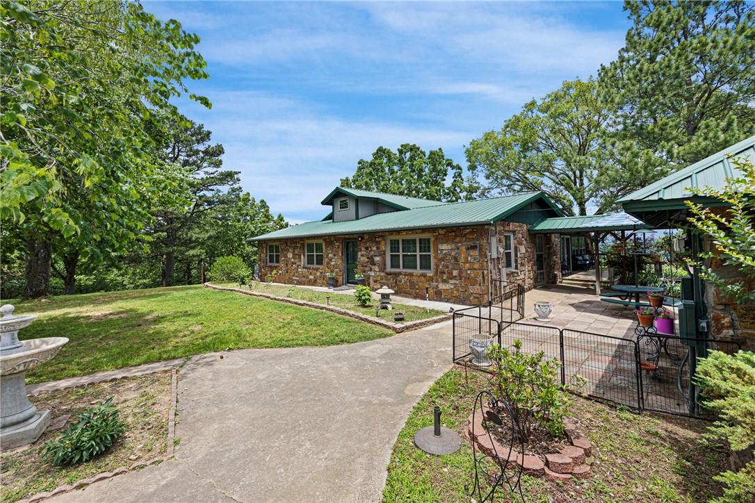 Spacious 4200sf home ready for the next chapter! Unobstructed Panoramic sweeping Views off the back deck! Updated open concept kitchen with new cabinets island and granite tops, 2 screened in pantry's, mud room and home office. New main floor laundry room. Basement has bar area with living room and another huge room that can be a media/game room or third living room. Beautiful outside oasis includes koi pond with waterfalls and flower gardens all around, large covered pavilion and gazebo.... You could have wedding pic's here or a beautiful Airbnb or keep it all for yourself. Close to camping, rivers and waterfalls.
30X50 Metal beam shop w/8''concrete floor w/15X50 lean to attached and full bathroom, extra tall drive through garage doors on each end. Building also has its own meter w/200amp svs.. BONUS-Free natural gas COMES ALONG WITH THIS PROPERTY! Make your appointment today! Agent owned.