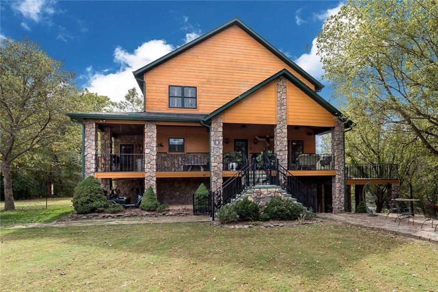 Custom home overlooks Norfork River with 311 ft. of shoreline. The elegant Hickory wood floors and Cypress walls flow throughout the house. Gourmet kitchen includes Miele German Coffee Maker and Vegetable steamer. Viking 6 burner range, double ovens, Sub-zero refrigerator. Full size wine fridge. Outdoor living includes stone fire pit. Party house with fireplace for entertaining. Full outside kitchen and a series of decks and patio, boat launch on one of world’s best trout fishing rivers.