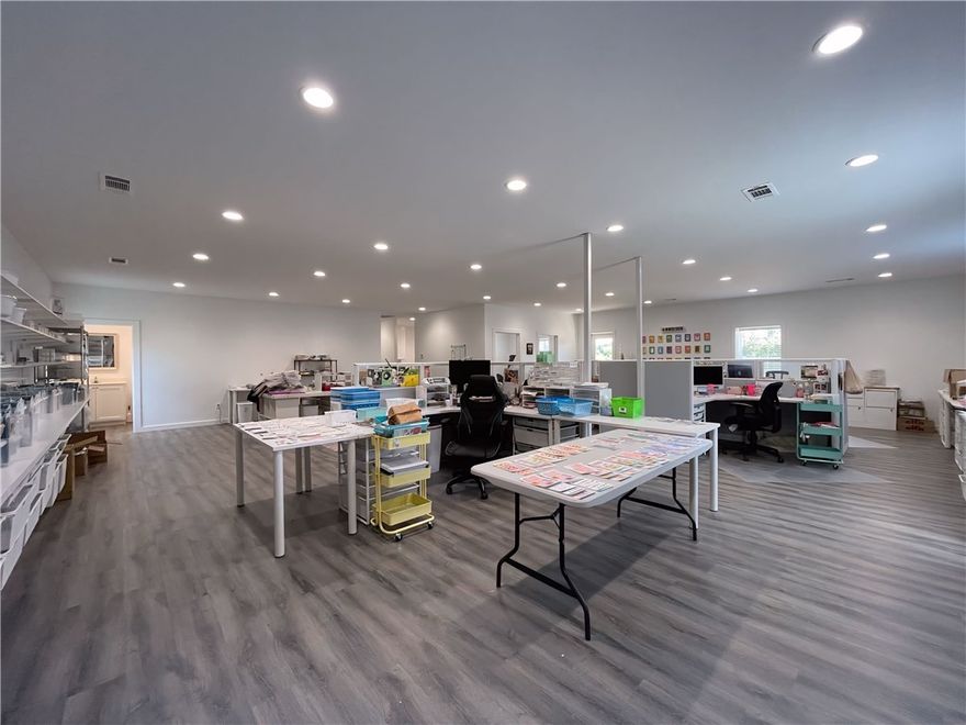 This 3200 sq ft facility is newly constructed on 1.17 acres, just a block off of Hwy 7. Custom designed and built in 2023 with focus on beauty and function. The south side of the building features a 2000 sq ft design studio/ retail space, with abundant lighting, luxury vinyl flooring, clean white walls and trim, half bath, full kitchen with dining area, social media photography room, and a 13x14 storage room. This open concept lends itself to a plethora of possibilities to customize the space to suit your needs! Just down the hall you’ll enter into a 1200 sq ft warehouse space, with a large insulated overhead door, half bath, high ceilings, 3 ton ductless heat and air unit for comfort, and 2 additional exterior doors. The state of the art security system lets you keep an eye on your space while you’re away. Large green space out back, several mature trees, large gravel parking area, and a circle drive. With such a large lot, there is plenty of room to add on if needed.
