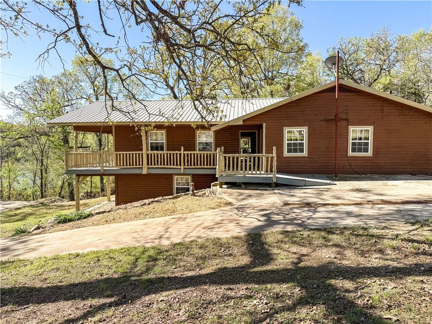 BULL SHOALS LAKE VIEW!!!  Don't miss this beautiful home that has a lake view from every spot on the covered wrap around deck and adjoins corp of engineer land on 2 sides..  Throw in end of the road privacy and you have the perfect lake home. 4 bedrooms, 4 bathrooms gives you plenty of space for family and friends. Throw in a huge living room and dining room and you are ready to entertain.  The 2 car garage is deep enough to keep your boat in, has a private well, concrete parking, covered carport, large propane tank, metal roof is 12 years old, hardwood floors, double oven and a handicap accessible bathroom.