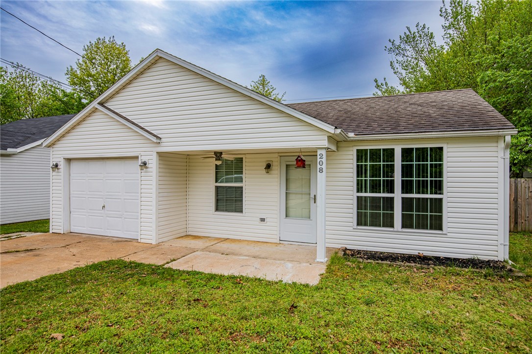 Super Cute Dollhouse in great location near parks, downtown and convenient to I-49. Home features 2 bedrooms, 1 bath with gas log fireplace in living room. Large yard with privacy fence, large deck and a storage building. Come check out this great home priced at only $200,000! Welcome Home!