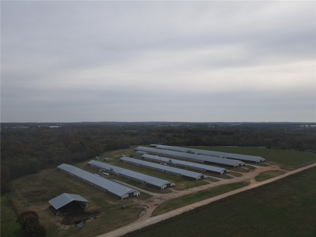 Good income with all the country farm extras. (2) 66 x 600 and (4) 40 x 400 broiler houses on 65 acres m/l with 2 dwellings. Farm is in incredible shape and producing. This farm has been approved by both Simmons and Tyson's and is fully updated. Lots of extras included like studio apartment over the water shop. Acreage is a mix of open and wooded with a live spring fed stream running through that is also the water source for the farm. Rural water backup available and a roubidoux well to boot. The hunting is unmatched with deer and turkey everywhere. The house overlooks the valley and stream with a large deck to relax and enjoy the country life. a must see.