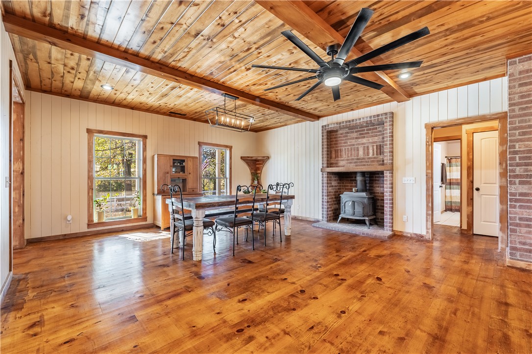 Updated to add MORE ACREAGE!! Check out this gorgeous & hard to find estate property! Beautiful and spacious home on 10 acres, including partial ownership of a 7 acre shared lake. A backyard paradise including an amazing large hot tub, semi-inground pool w/ splash pad and an super fun playground with forts, tunnels, slides & a climbing wall. Numerous raised beds for veggies & fruits as well as an established orchard with fruit and berry trees. Raise your own chickens & bunnies in the established hutches. As well as cattle/horse in the stable and 10 acres to roam. The large shop with lean-to is perfect for DYI projects and addtl storage. Shared with a couple neighbors, a private lake for fishing, swimming and relaxing right at home.
All of these county amenities and so close to town! Tyson School of Innovation and Park, stores and shopping are super close, as well as a short drive away from Beaver Lake public use area.
Also see listings separate mls listing#1292089 for addtl property/5 more acres available.