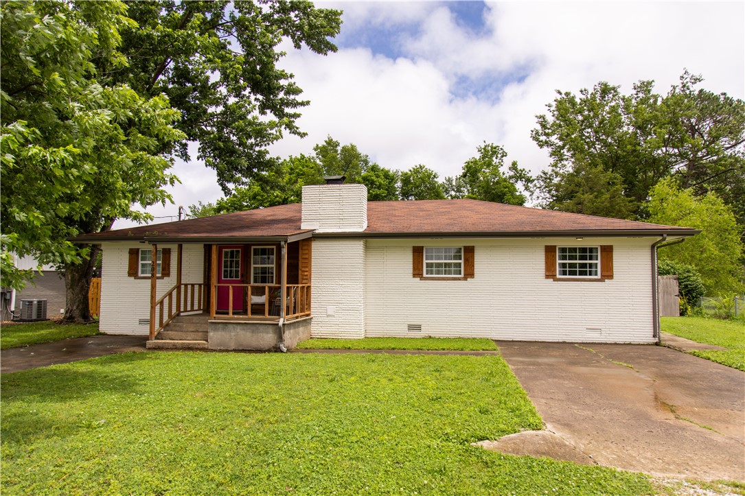 Minutes from Coler Mountain Bike Preserve and the 3rd Street bike path, this one-level, 4-bedroom home offers an unbeatable location with quick access to Downtown Bentonville, Crystal Bridges, and the new Walmart Home Campus. Sitting on a flat and oversized 0.28-acre lot, the property includes an outbuilding with potential for a guest house, garage, or creative flex space. Granite counters, a split floor plan, and keyless entry add comfort and convenience, and furnishings can convey for a truly move-in-ready option.