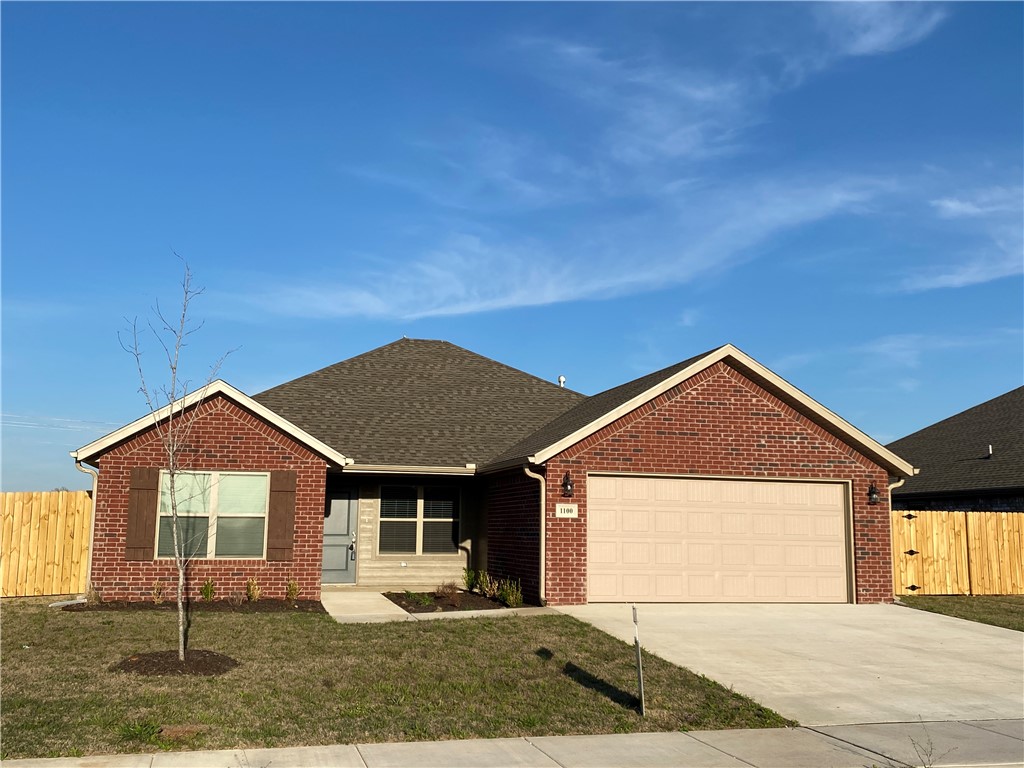 Location! Location! New, quality constructed home in Hilldale Subdivision. This lovely, single-story home is centrally located, close to top rated schools, shopping, restaurants, the Bentonville Square and Wal-Mart Headquarters. Inside, youāll find an open floor plan with a gas log fireplace in the living room. The kitchen has beautiful grey cabinets, 3cm granite countertops and a subway tile backsplash plus stainless steel appliances including a gas range. The primary suite boasts a tiled shower, double sink vanity, and a walk-in closet. Home also comes with LVP flooring throughout the main living areas and carpeting in the bedrooms. Home is situated on a large fully sod lot with a full privacy fence and guttering. 100% financing available through RD Financing to those who qualify.