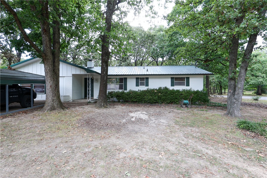 Beautiful 5 bedroom, 3 1/2 bath home settled in a quiet cul-de-sac. Yard is full of big beautiful trees. Primary bedroom has a door out to the back yard with a covered patio. Property has two large out buildings that would make perfect small shops, but the don't currently have electricity hooked to them, but lots of potential.