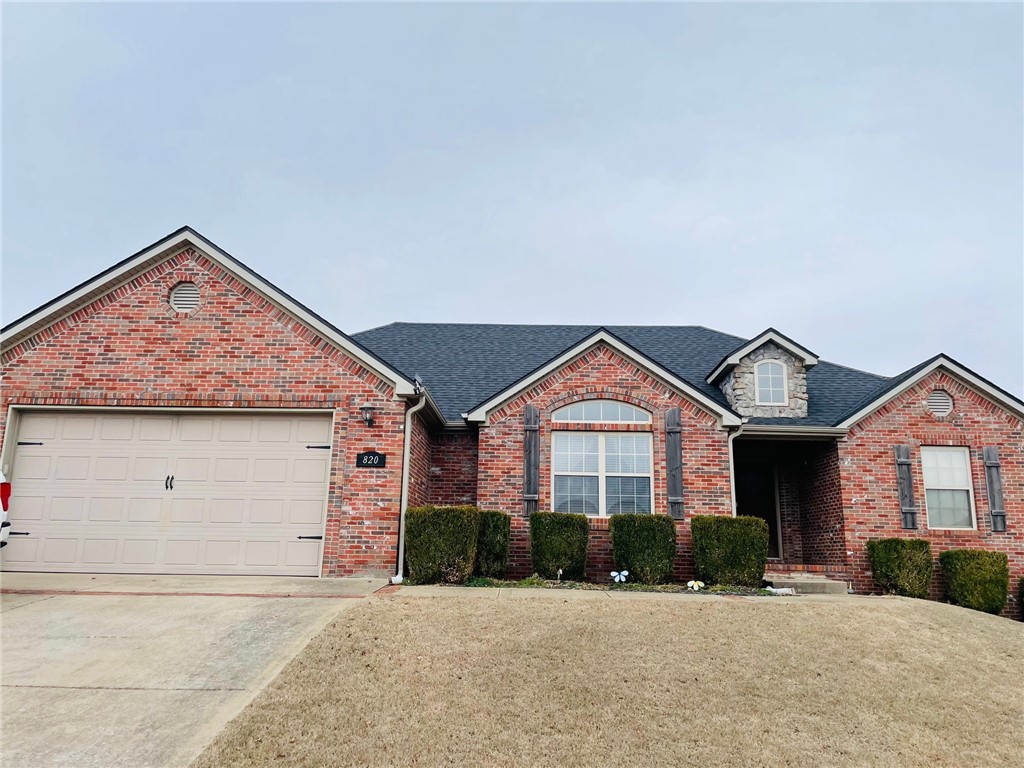 Centerton home in the Sienna Estates subdivision. You will love the split floorplan and the spacious rooms. Added decorative details throughout the home give it a modern touch. The living room has wood flooring and a beautiful gas log fireplace. The kitchen features stainless steel appliances, an electric range, pantry and additional bar area with an eat-in kitchen. There is an extra room that could be used as a formal dining room, play room, or office. The large master bedroom has en-suite with tub, separate shower, dual vanities and a large walk-in closet. Two additional bedrooms, a second full bath and additional storage complete this split floorplan. Step out onto a wooden deck in this fully fenced backyard complete with separate garden area where you can enjoy the heirloom tomatoes.