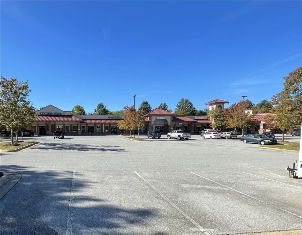 Built out bakery space with some equipment negotiable. The space has great visibility and ability for building signage. Quick access to the Fulbright Expressway. Mud Creek Trail, a branch of the Razorback Greenway Trail, is directly behind the building and runs through the property. Please do not text for showings.