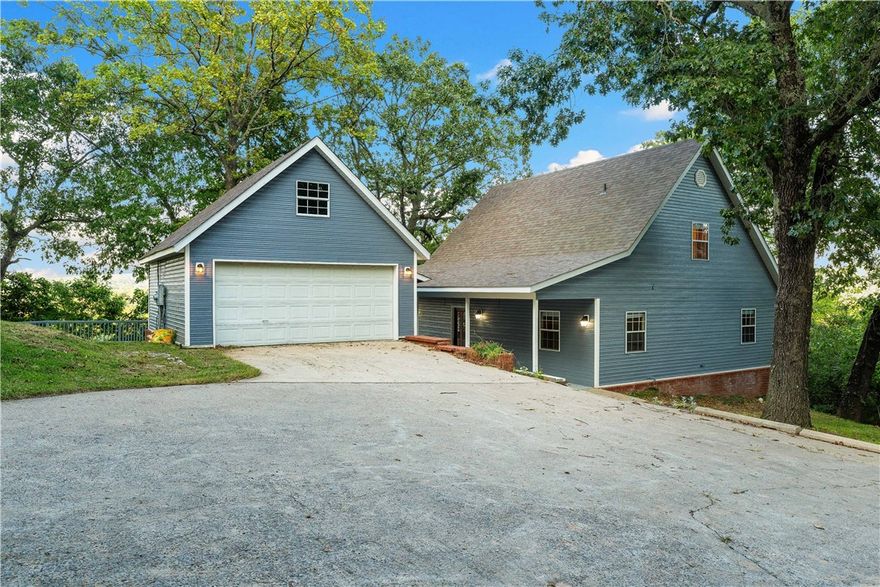 Back on market due to buyer's financing. Nestled just off Hwy 412 on a 5.5-acre bluff, this beautiful home boasts breathtaking views of the White River arm of Beaver Lake. Offering 3 bedrooms and 2 bathrooms, the home features expansive windows that fill the space with natural light while framing picturesque water views. Updates make this property move-in ready, including a new HVAC system (2023), new roof (2021), updated appliances (2022), fresh exterior paint (2024), and lake-facing windows (2023). Outdoor living shines with multiple decks perfect for a retreat like setting. The private, tree-shaded setting offers plenty of space to stretch out and unwind, with a flat yard area ideal for parking a boat, camper, etc.  Located just 1.5 miles from a public boat launch and a quick 7-minute drive to Springdale, this home is the perfect primary residence or waterfront investment home. Don’t miss the opportunity to see this one-of-a-kind property in person— request the video walk through or schedule your showing today!