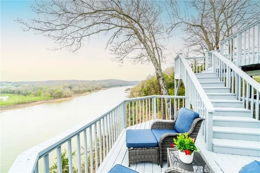 Nestled just off Hwy 412 on a serene 5.5-acre bluff, this beautifully updated home boasts breathtaking views of the White River arm of Beaver Lake. Offering 3 bedrooms and 2 bathrooms, the home features expansive windows that fill the space with natural light while framing picturesque water views. Updates make this property move-in ready, including a new HVAC system (2023), new roof (2021), updated appliances (2022), fresh exterior paint (2024), and lake-facing windows (2023). Outdoor living shines with multiple decks perfect for a retreat like setting. The private, tree-shaded setting offers plenty of space to stretch out and unwind, with a flat yard area ideal for parking a boat, camper, etc.  Located just 1.5 miles from a public boat launch and a quick 7-minute drive to Springdale, this home is the perfect primary residence or waterfront investment home. Don’t miss the opportunity to see this one-of-a-kind property in person— request the video walk through or schedule your showing today!
