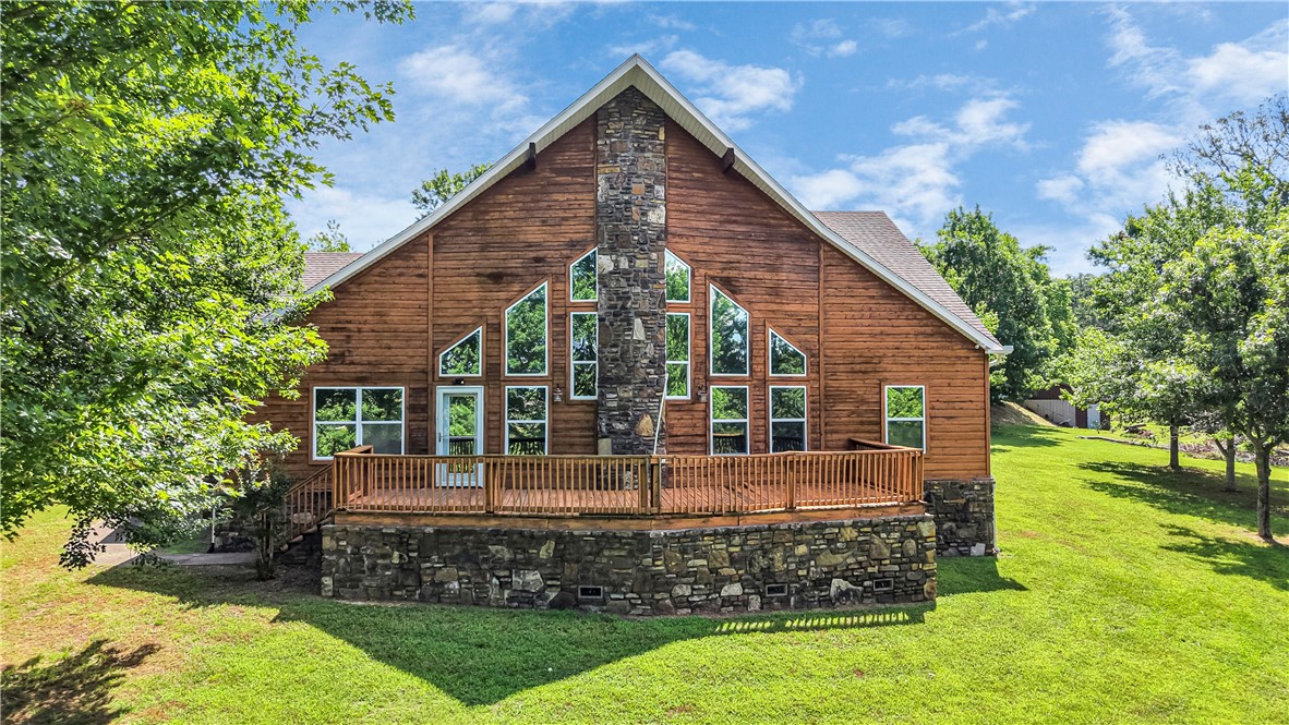 Discover the perfect blend of comfort, space, and opportunity with this well-maintained home nestled on 9 picturesque acres right in the heart of Huntsville. With a prime location, and only 1 mile from Highway 412, this rare property offers unmatched convenience and incredible development potential. Step inside to an open floor plan featuring a cozy fireplace. The spacious kitchen is truly the heart of the home, complete with granite countertops, ample cabinetry, and an eat-in dining area—designed for both style and function. Additional highlights include a bright sunroom, a convenient half bath for guests, and a primary suite featuring oversized walk-in closets, ensuite bath, and a connected office space perfect for remote work. A massive detached workshop/garage with four bays provides space for equipment storage. All of this is set within city limits, minutes from Huntsville’s parks, schools, and restaurants. Whether you're looking to settle in, build, or invest—this property offers endless possibilities.