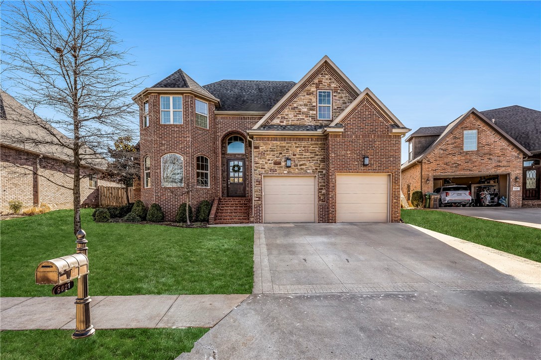 Welcome home to this immaculate 5 bed/4 ba 1 owner home in the prestigious gated community of Shadow Valley, located near all NWA has to offer! This inviting home features soaring 20' ceilings, an open living room leading to a chef's kitchen with removable butcher block in the center island and built in professional fridge & freezer, a 6'x16' hidden pantry, and a private primary suite on the main floor including integrated speakers in the primary bedroom and living room. Upstairs feature a split floor plan with 4 bedrooms, one which could be used for a media or bonus room, 2 full bathrooms, and an added flex room with beautiful built-ins and added storage under the day bed. The backyard features a covered patio and full privacy with no neighbors behind you.